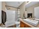 This bathroom has a tub and shower combination, a white sink, and a modern vanity at 3232 Brayton Mist Dr, North Las Vegas, NV 89081