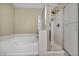 Bathroom featuring a tub and glass enclosed shower with tile flooring at 3232 Brayton Mist Dr, North Las Vegas, NV 89081