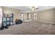 A Bonus Room that features neutral paint, carpet flooring, ceiling fan and staircase at 3232 Brayton Mist Dr, North Las Vegas, NV 89081