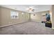 The bonus room features neutral paint, carpet flooring, and a ceiling fan at 3232 Brayton Mist Dr, North Las Vegas, NV 89081