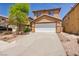 Inviting two-story home with a well-maintained front yard and an attached two-car garage at 3232 Brayton Mist Dr, North Las Vegas, NV 89081