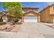 Inviting two-story home with a well-maintained front yard and an attached two-car garage at 3232 Brayton Mist Dr, North Las Vegas, NV 89081