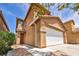 Attractive two-story home with a two-car garage and drought-tolerant landscaping at 3232 Brayton Mist Dr, North Las Vegas, NV 89081