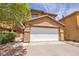 Attractive two-story home with a two-car garage and drought-tolerant landscaping at 3232 Brayton Mist Dr, North Las Vegas, NV 89081