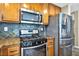 Kitchen appliances include stainless steel refrigerator, black gas range, and microwave at 3232 Brayton Mist Dr, North Las Vegas, NV 89081
