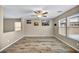Bright living space with wood-look flooring, natural light, and second story access at 3232 Brayton Mist Dr, North Las Vegas, NV 89081