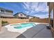 Backyard pool and jacuzzi with concrete patio and brick fence at 3232 Brayton Mist Dr, North Las Vegas, NV 89081