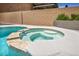 Close up of the pool's spa with tile accents, surrounded by a concrete patio at 3232 Brayton Mist Dr, North Las Vegas, NV 89081
