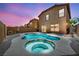 Backyard pool and jacuzzi with colorful sunset at 3232 Brayton Mist Dr, North Las Vegas, NV 89081