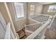 Carpeted staircase with white railing leading to the bonus room upstairs at 3232 Brayton Mist Dr, North Las Vegas, NV 89081