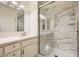 Bathroom featuring a marble shower with a glass enclosure and a vanity with modern lighting at 3253 Mystic Ridge Ct, Las Vegas, NV 89129