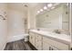 Bathroom includes dual sinks, updated countertops and shower-over-tub at 3253 Mystic Ridge Ct, Las Vegas, NV 89129