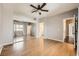 Spacious bedroom featuring hardwood floors, ceiling fan, and closet with mirrored sliding doors at 3253 Mystic Ridge Ct, Las Vegas, NV 89129
