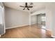 Bedroom features a ceiling fan, light gray walls, and mirrored closet doors at 3253 Mystic Ridge Ct, Las Vegas, NV 89129