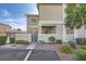 Well-maintained building exterior with landscaped grounds, a gated entrance, and an outdoor patio at 3253 Mystic Ridge Ct, Las Vegas, NV 89129