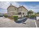 Townhouse complex featuring neutral exteriors, well-kept landscaping and ample parking at 3253 Mystic Ridge Ct, Las Vegas, NV 89129