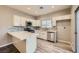 Modern kitchen featuring white cabinets, stainless steel appliances, and a breakfast bar at 3253 Mystic Ridge Ct, Las Vegas, NV 89129
