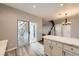 Kitchen offers a large island with stone countertops and sliding door access at 3253 Mystic Ridge Ct, Las Vegas, NV 89129
