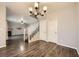 Open living room floorplan with hardwood floors, staircase and fireplace at 3253 Mystic Ridge Ct, Las Vegas, NV 89129
