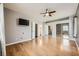 Large main bedroom with ceiling fan, hardwood floors, and attached bath access at 3253 Mystic Ridge Ct, Las Vegas, NV 89129