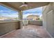 Covered patio with tiled flooring and views of the community, perfect for outdoor living at 3253 Mystic Ridge Ct, Las Vegas, NV 89129