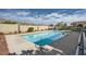 Community pool with clear blue water and mountain views, surrounded by a concrete deck at 3253 Mystic Ridge Ct, Las Vegas, NV 89129