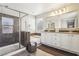 Modern bathroom featuring a glass-enclosed shower and a separate soaking tub at 334 E Neal Ave, Las Vegas, NV 89183