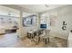 Cozy home office space with tiled floors, modern chandelier, and decorative wall art at 334 E Neal Ave, Las Vegas, NV 89183