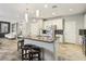 Bright kitchen island with granite countertops, white cabinets, and stainless steel appliances at 334 E Neal Ave, Las Vegas, NV 89183