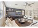Stylish living room featuring a large sectional sofa, contemporary decor, and bright natural light at 334 E Neal Ave, Las Vegas, NV 89183