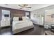 The main bedroom boasts modern decor, hardwood floors, and a decorative ceiling fan at 334 E Neal Ave, Las Vegas, NV 89183