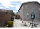 The two-story home features an expansive backyard with block fencing and concrete patio at 3440 Crystal Tower St, Las Vegas, NV 89129