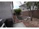 Cozy backyard area with gravel landscaping and mature trees near the house at 3440 Crystal Tower St, Las Vegas, NV 89129