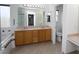 A spacious bathroom features a double sink vanity, soaking tub, and a glass-enclosed shower at 3440 Crystal Tower St, Las Vegas, NV 89129