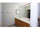 Bathroom vanity with double sinks, tiled floors, a large mirror and ample lighting at 3440 Crystal Tower St, Las Vegas, NV 89129