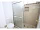 Bathroom featuring tile shower with glass doors and simple toilet at 3440 Crystal Tower St, Las Vegas, NV 89129