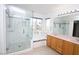Bright bathroom featuring a glass-enclosed shower, soaking tub, and a double sink vanity at 3440 Crystal Tower St, Las Vegas, NV 89129