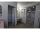 Bathroom with tile floors, vanity, walk-in closet, and mirrored closet door to the bedroom at 3440 Crystal Tower St, Las Vegas, NV 89129