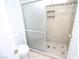 Tiled shower with glass doors and corner shelves, paired with a toilet, complements the bathroom at 3440 Crystal Tower St, Las Vegas, NV 89129