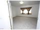 Bedroom offers neutral walls, plush carpet, and window with dark decorative curtains at 3440 Crystal Tower St, Las Vegas, NV 89129