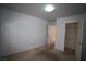A basic bedroom with carpet, ceiling light, and doors to closet and hallway at 3440 Crystal Tower St, Las Vegas, NV 89129