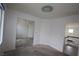 Bedroom with mirrored closet and attached room with view of stairs at 3440 Crystal Tower St, Las Vegas, NV 89129