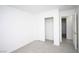 Simple bedroom with neutral carpet, sliding closet doors and access to the rest of the house at 3440 Crystal Tower St, Las Vegas, NV 89129