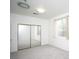 Bright bedroom with carpet, mirrored closet doors and a window with neutral curtains at 3440 Crystal Tower St, Las Vegas, NV 89129