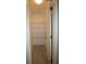 A simple closet with shelves, hanging space, and plank floors at 3440 Crystal Tower St, Las Vegas, NV 89129