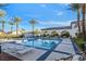 Sparkling pool surrounded by palm trees and lounge chairs, offering a refreshing retreat for residents at 3440 Crystal Tower St, Las Vegas, NV 89129