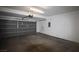 Spacious two-car garage featuring an automatic door and ample room for storage at 3440 Crystal Tower St, Las Vegas, NV 89129