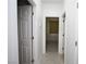 Hallway with neutral walls and flooring, showcasing multiple doors and access points at 3440 Crystal Tower St, Las Vegas, NV 89129