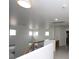 Hallway features an interior built-in desk and neutral paint, with windows to let natural light in at 3440 Crystal Tower St, Las Vegas, NV 89129