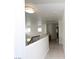 Bright hallway featuring hardwood floors, white walls, natural lighting, and wood trim at 3440 Crystal Tower St, Las Vegas, NV 89129